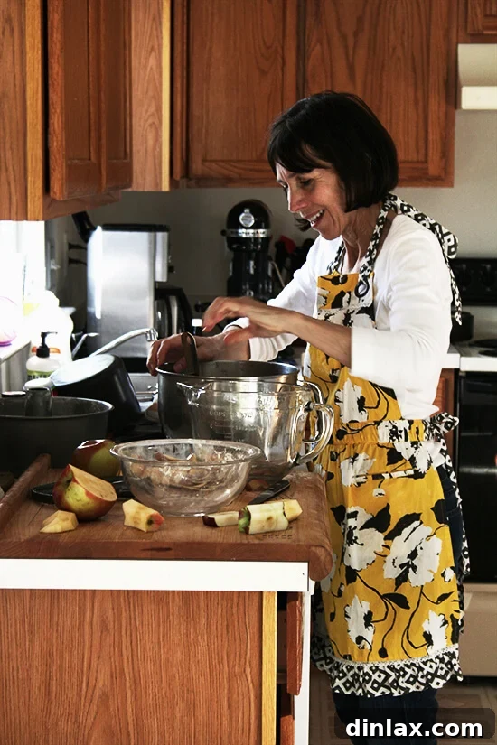 My mama making Teddie's apple cake. A heartwarming moment of a mother preparing a cherished family recipe, ensuring every step is perfect for this moist apple cake.