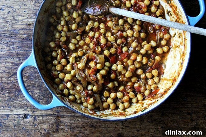 Sweet and Savory Chickpea Tagine with Tomato Jam and Roasted Delicata Squash 14 The Chickpea Tagine, rich and bubbling, simmering in the Le Creuset braiser, with the 'tomato jam' having visibly thickened.