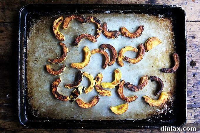 Sweet and Savory Chickpea Tagine with Tomato Jam and Roasted Delicata Squash 17 Beautifully roasted delicata squash slices, golden-brown and tender, fresh out of the oven on a sheet pan.