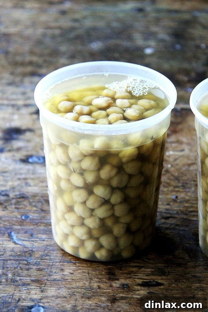 Mastering Homemade Chickpeas and Beans 2 A quart container filled with cooked chickpeas.