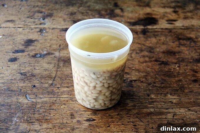Mastering Homemade Chickpeas and Beans 9 A quart container filled with cooked white beans.