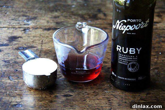 Gastrique ingredients: sugar, vinegar, port ready to be used in a saucepan.