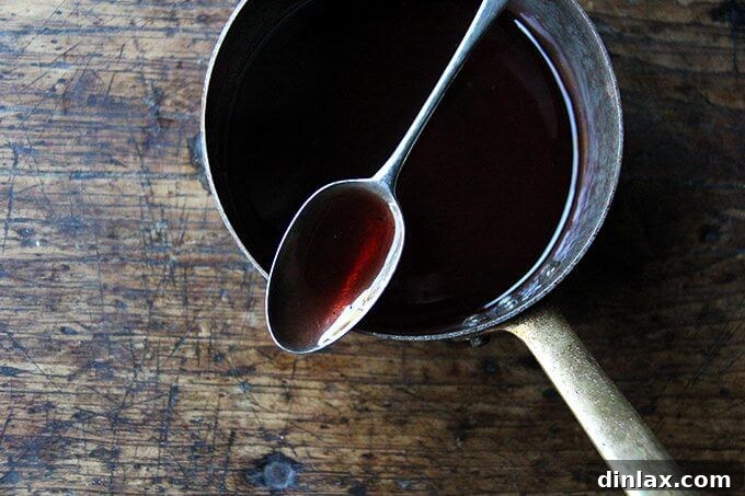 A saucepan filled with the finished, reduced gastrique, appearing as a rich, glossy syrup.