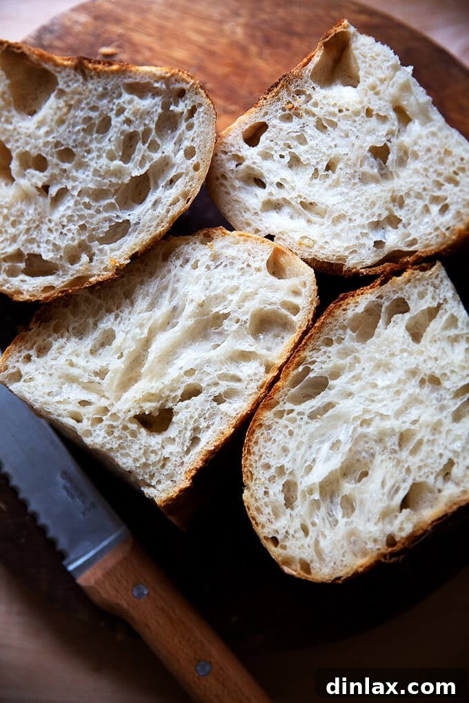 Mastering Sourdough: A Step-by-Step Homemade Journey 18 A stack of perfectly sliced sourdough bread, ready to eat.