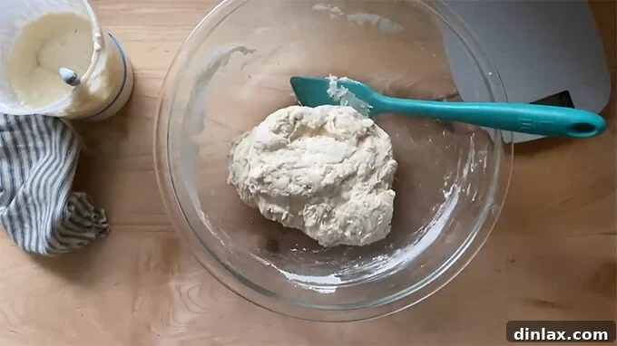Mastering Sourdough: A Step-by-Step Homemade Journey 10 A bowl holding just-mixed sourdough bread dough.
