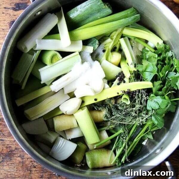 A pot of homemade vegetable stock, shimmering with a rich golden hue, ready to be used in countless culinary creations.