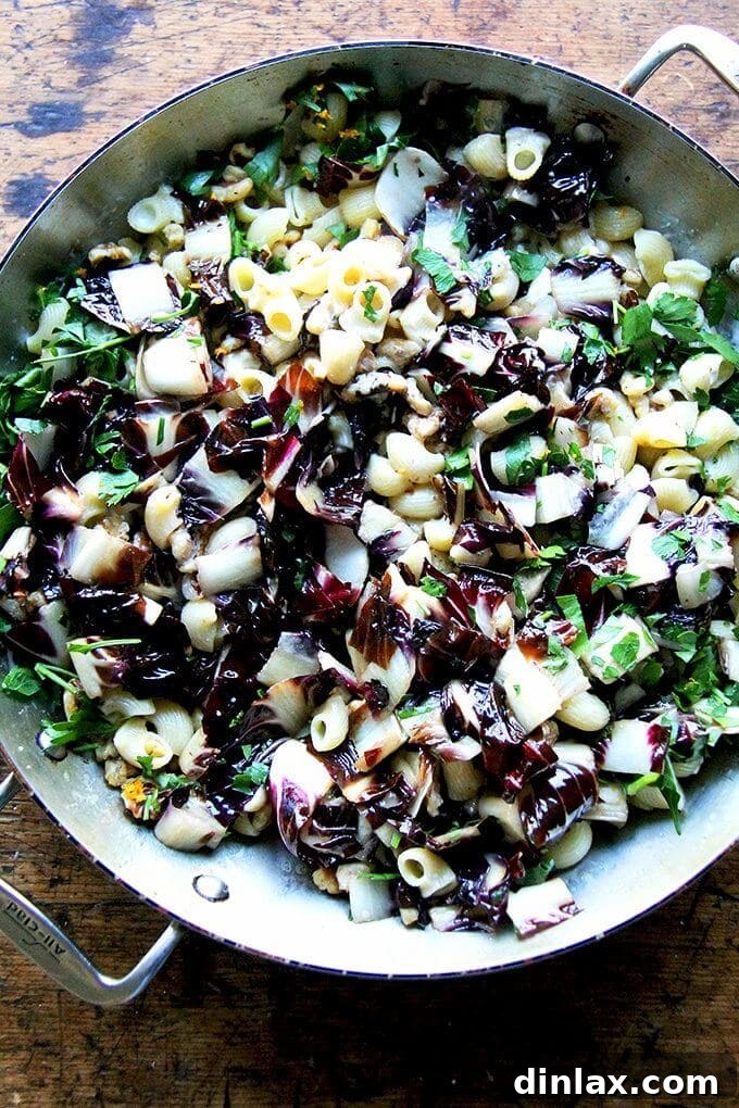 Silky radicchio pasta with walnuts, parsley, and orange zest, finished with fresh pepper and Pecorino, ready in under 10 minutes.