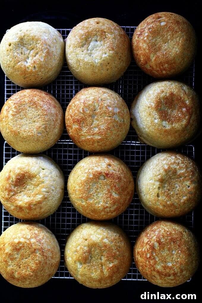 Freshly baked artisan bread with a golden crust, ready to be sliced.