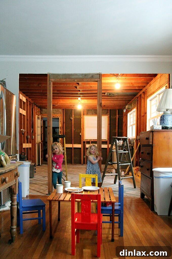 A pair of warm, crusty peasant bread loaves cooling on a wire rack after being freshly baked.