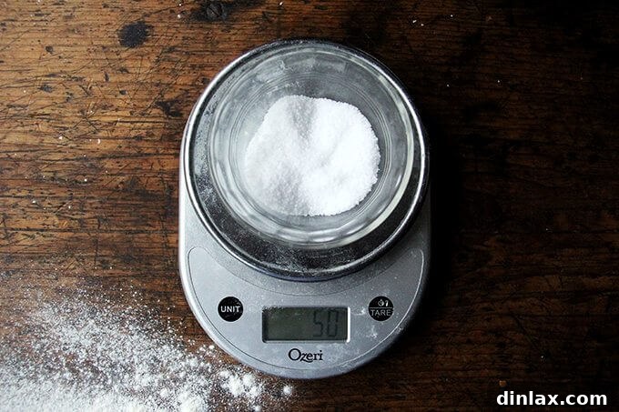 A small pile of kosher salt ready to be added to the bread ingredients.