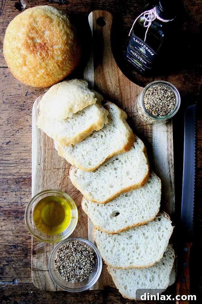 Crunchy Nut-Free Dukkah Blend 2 Homemade bread with good olive oil and a bowl of smoky, seedy nut-free dukkah, perfect for an appetizer.