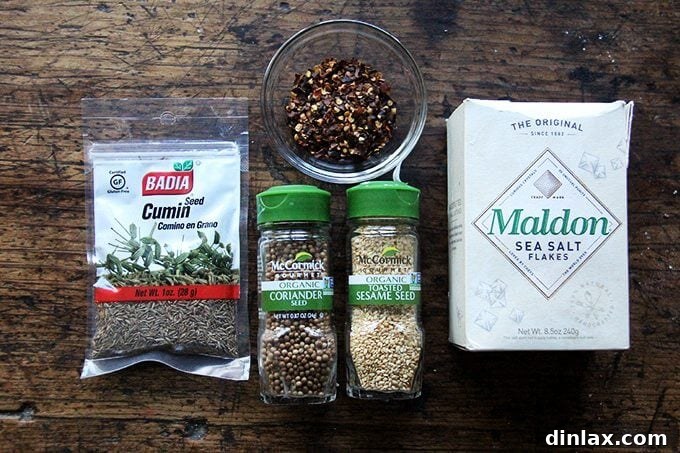 Crunchy Nut-Free Dukkah Blend 3 A selection of whole spices and seeds: sesame seeds, coriander seeds, and cumin seeds, ready to be transformed into nut-free dukkah.