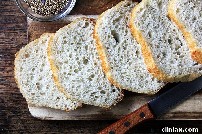 Crunchy Nut-Free Dukkah Blend 7 A board of freshly sliced homemade peasant bread, perfect for dipping.