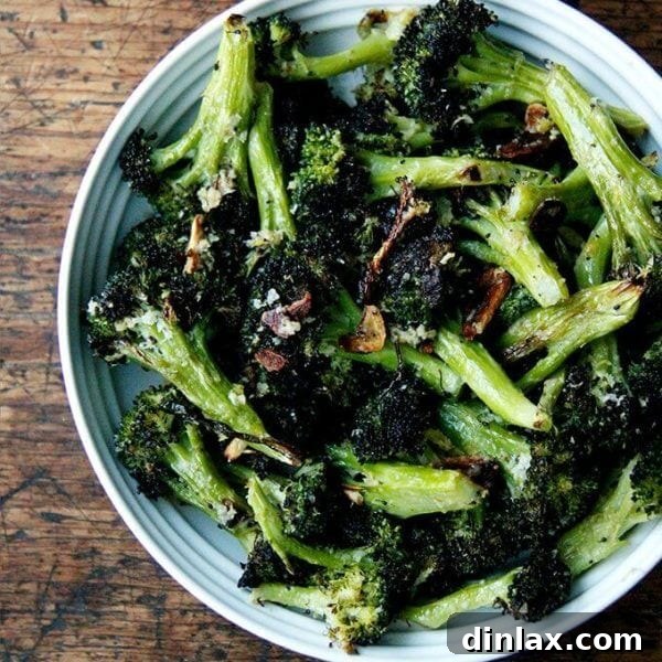 A bowl of roasted broccoli with lemon, garlic and parmesan.
