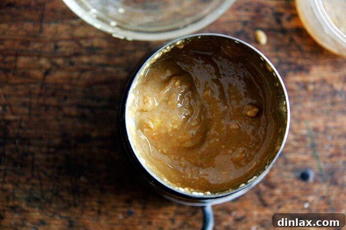 Golden Tofu and Broccoli with Savory Peanut Sesame Pesto 10 A close-up shot of the freshly made sesame-peanut pesto, showing its rich, creamy texture and vibrant color in a bowl.