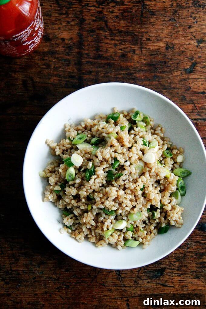 Your Ultimate Instant Pot Brown Rice: Perfect and Flavorful 2 A bowl of perfectly cooked and seasoned Instant Pot brown rice, garnished with fresh scallions and sesame seeds.