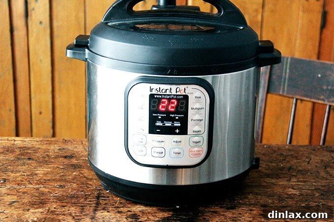 Your Ultimate Instant Pot Brown Rice: Perfect and Flavorful 6 The Instant Pot display showing the timer set for 22 minutes on high pressure.