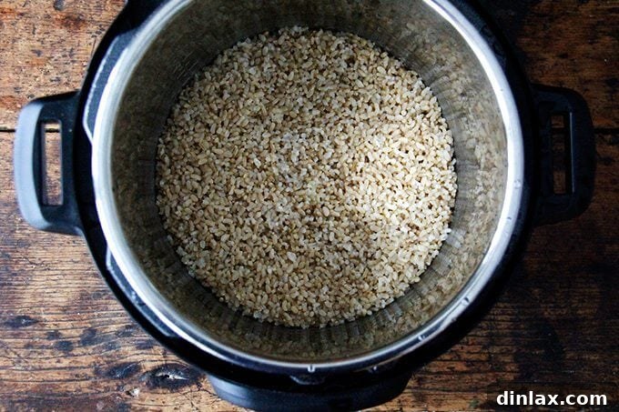 Your Ultimate Instant Pot Brown Rice: Perfect and Flavorful 7 An uncovered Instant Pot revealing perfectly cooked brown rice, fluffy and separated.