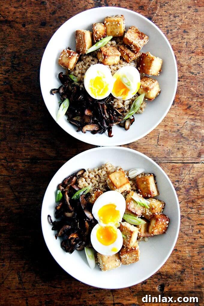 A bowl of brown rice, crispy tofu and mushrooms, and perfect instant pot soft-boiled eggs.