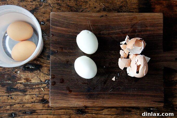 Two instant post soft-boiled eggs, freshly peeled.