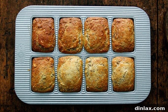 Three Seed Crisps 11 Freshly baked mini loaves of three-seed crackers, golden brown and firm, just out of the oven.