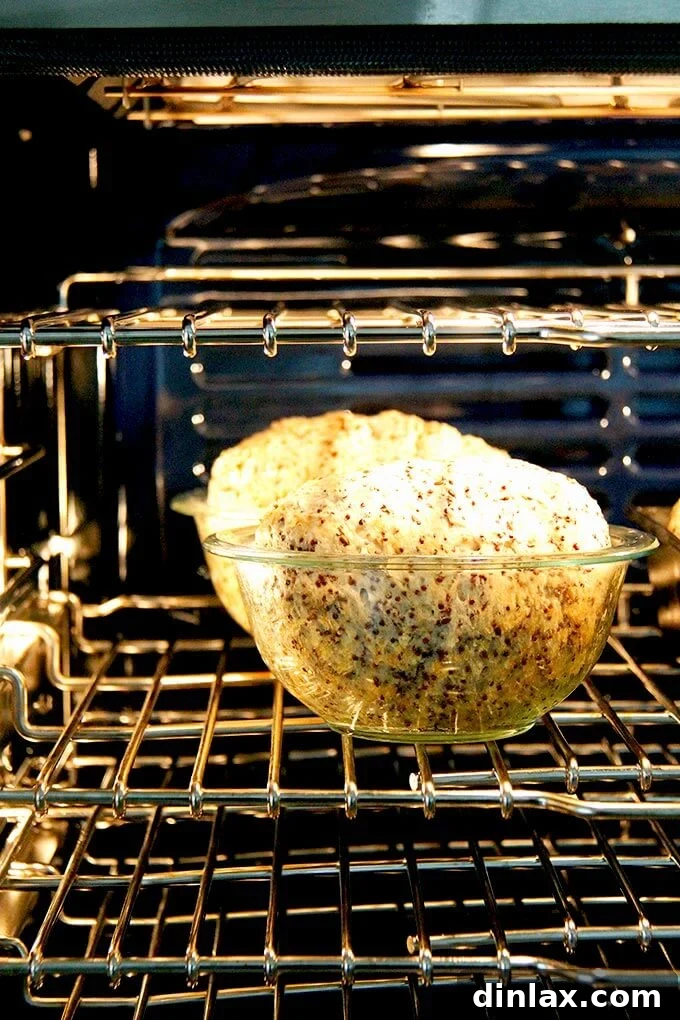 Golden Quinoa Flax Toast 15 A beautiful round loaf of quinoa-flax bread baking in a Pyrex bowl.