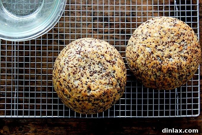 Golden Quinoa Flax Toast 16 A fresh round loaf of quinoa-flax bread cooling on a wire rack after baking.