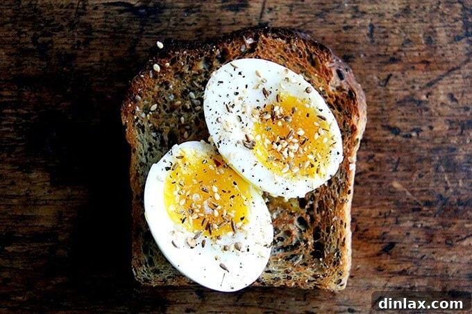 Golden Quinoa Flax Toast 20 A slice of quinoa-flax bread topped with soft-boiled eggs and a generous sprinkle of dukkah.