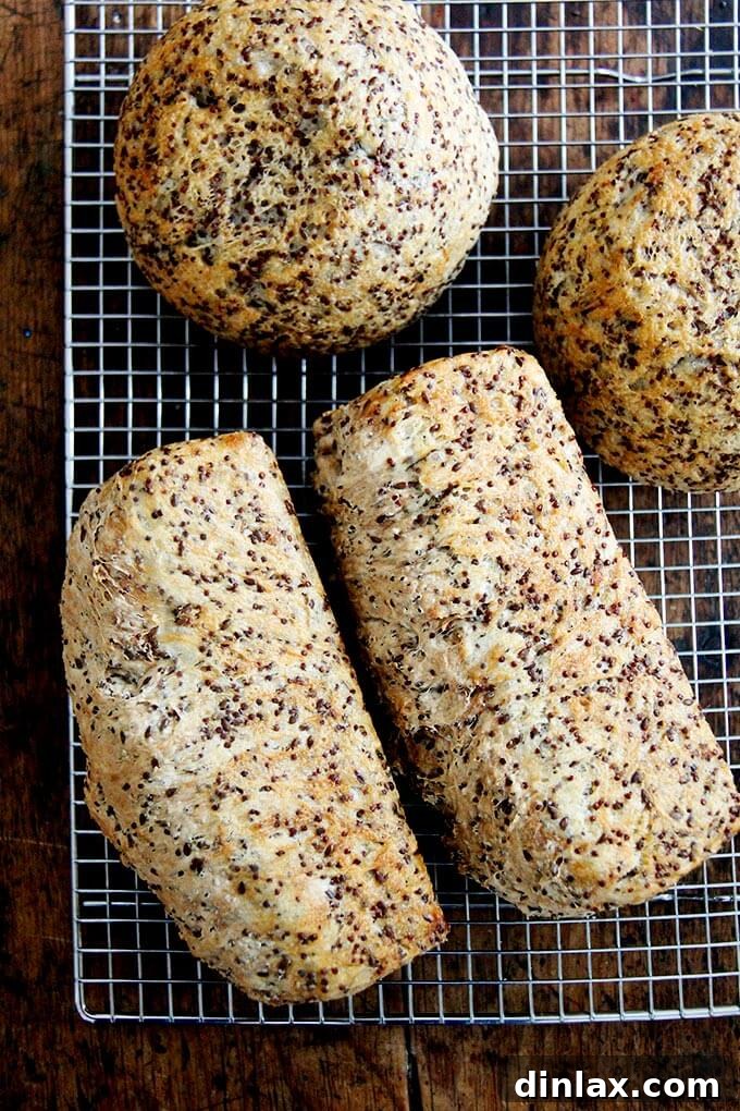 Golden Quinoa Flax Toast 9 Freshly baked quinoa-flax bread loaves cooling on wire racks.