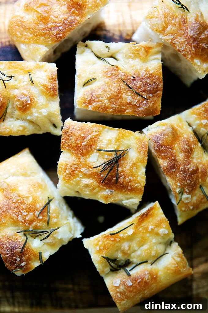 Close-up of a rustic focaccia loaf, showcasing its textured crust.