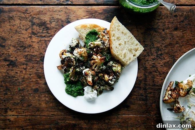 Roasted cauliflower with schug and yogurt sauce assembled on a platter