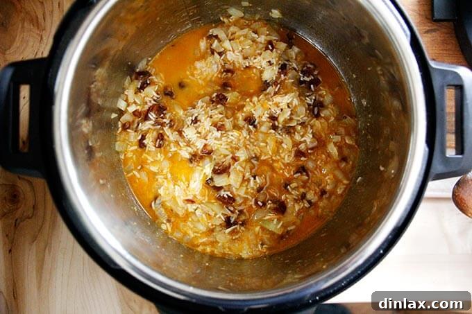 Instant Pot Harissa Rice with Sweet Dates and Zesty Orange 21 The Instant Pot, sealed and ready to cook, with the Moroccan rice mixture inside, promising a quick and delicious meal.