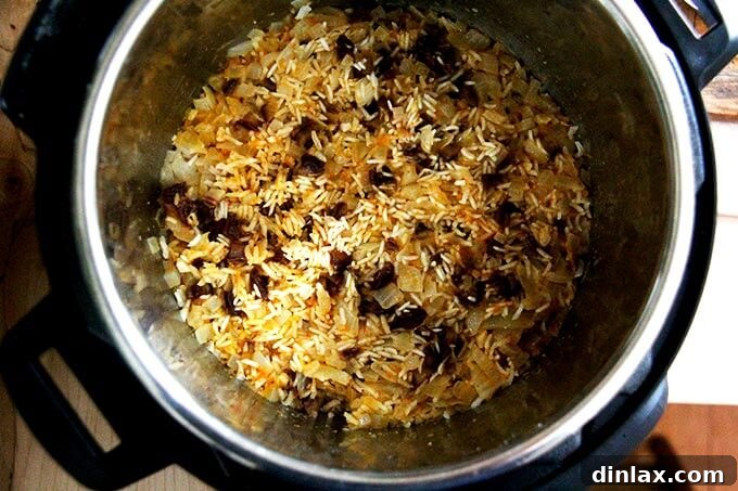 Instant Pot Harissa Rice with Sweet Dates and Zesty Orange 22 An overhead view of freshly cooked Moroccan Harissa Rice with dates and orange, fluffy and perfectly separated, inside the Instant Pot.