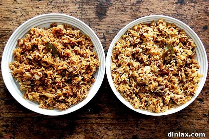 Instant Pot Harissa Rice with Sweet Dates and Zesty Orange 23 Two bowls of Moroccan rice side by side, one cooked in an Instant Pot (left) and one on the stovetop (right), showcasing subtle textural differences.