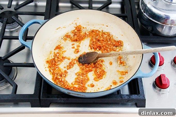 Instant Pot Harissa Rice with Sweet Dates and Zesty Orange 8 A skillet with harissa rice ingredients all stirred together, showcasing the even distribution of spices.