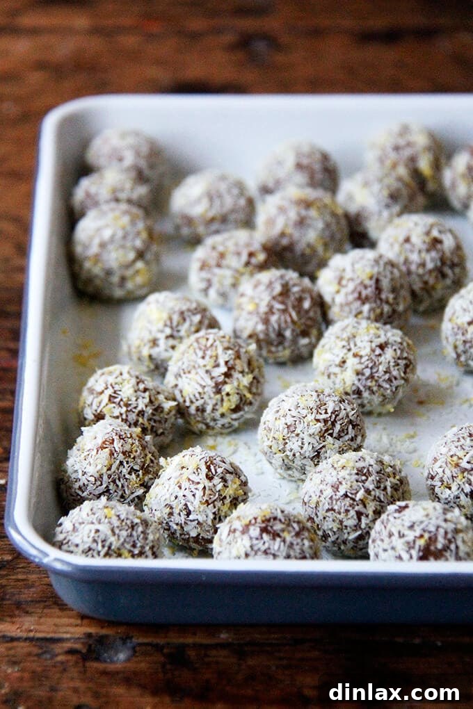 Zesty Lemon Coconut Date Bites 2 A tray of lemon-coconut date balls.