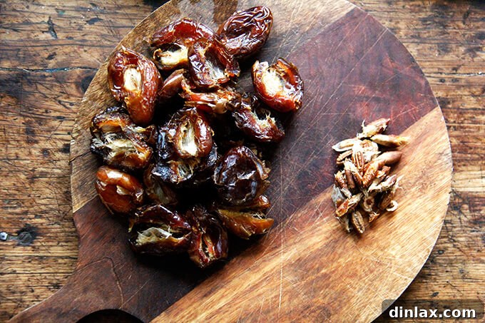 Zesty Lemon Coconut Date Bites 6 A board with pitted dates aside pits.