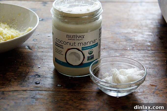 Zesty Lemon Coconut Date Bites 8 A jar filled with coconut manna.