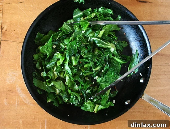 A close-up shot of bitter greens, highlighting their texture and readiness for wilting.