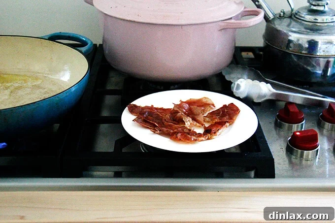 The final plating, garnished with fresh herbs and cheese.