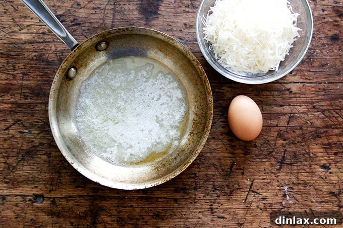 Uncooked potato gnocchi resting on a lightly floured surface, ready for boiling.