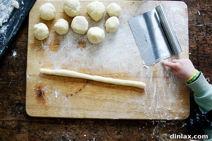 A close-up shot of the finished gnocchi, garnished with crispy prosciutto and sage.