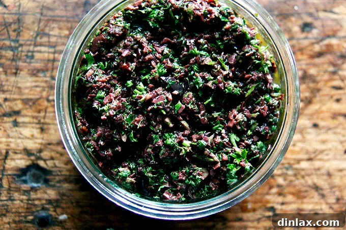 Zesty Olive Tapenade with Capers and Fresh Parsley 8 A beautifully presented bowl of black olive tapenade, ready for serving.