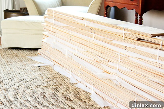 New hardwood flooring stacked in living room for acclimation before kitchen installation