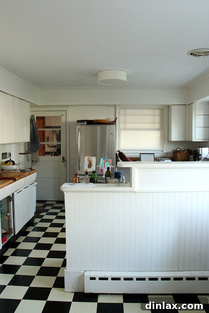 A candid moment showing family life continuing in the kitchen, despite its impending transformation. Family time in the old kitchen before renovation