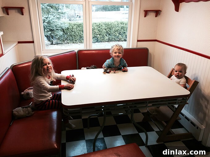 A glimpse of the old kitchen from the adjacent dining/living area, highlighting the dividing wall. Kitchen view from dining room, before wall removal
