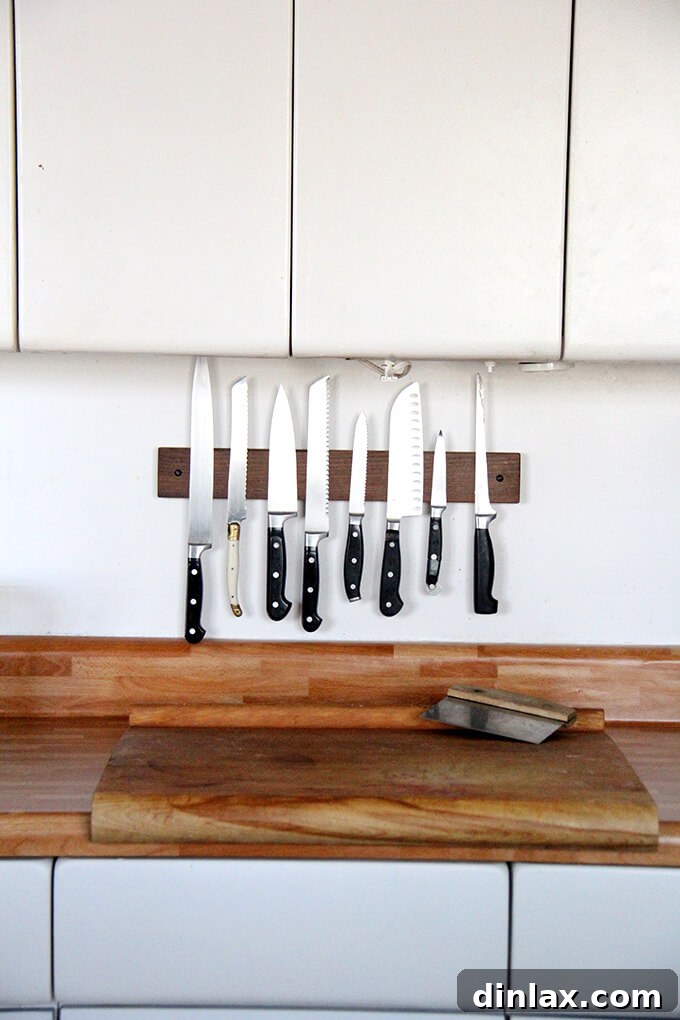 A detailed shot of the butcher block contact paper, offering a temporary but effective aesthetic upgrade. Close-up of contact paper on kitchen counter, showing improved aesthetics