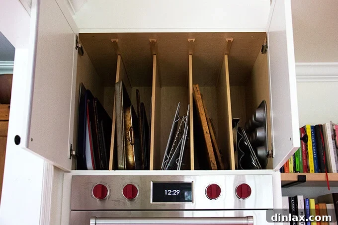 A convenient cabinet situated above the double oven, perfect for storing baking sheets or frequently used items.