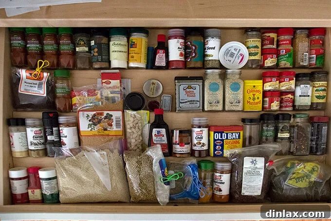 Specialized drawer insert designed for spice jars, ensuring easy access and tidy storage.