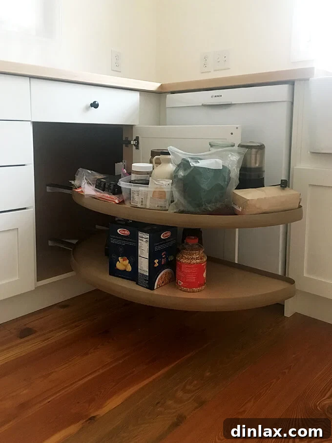 A pull-out lazy Susan cabinet, maximizing corner storage efficiency.